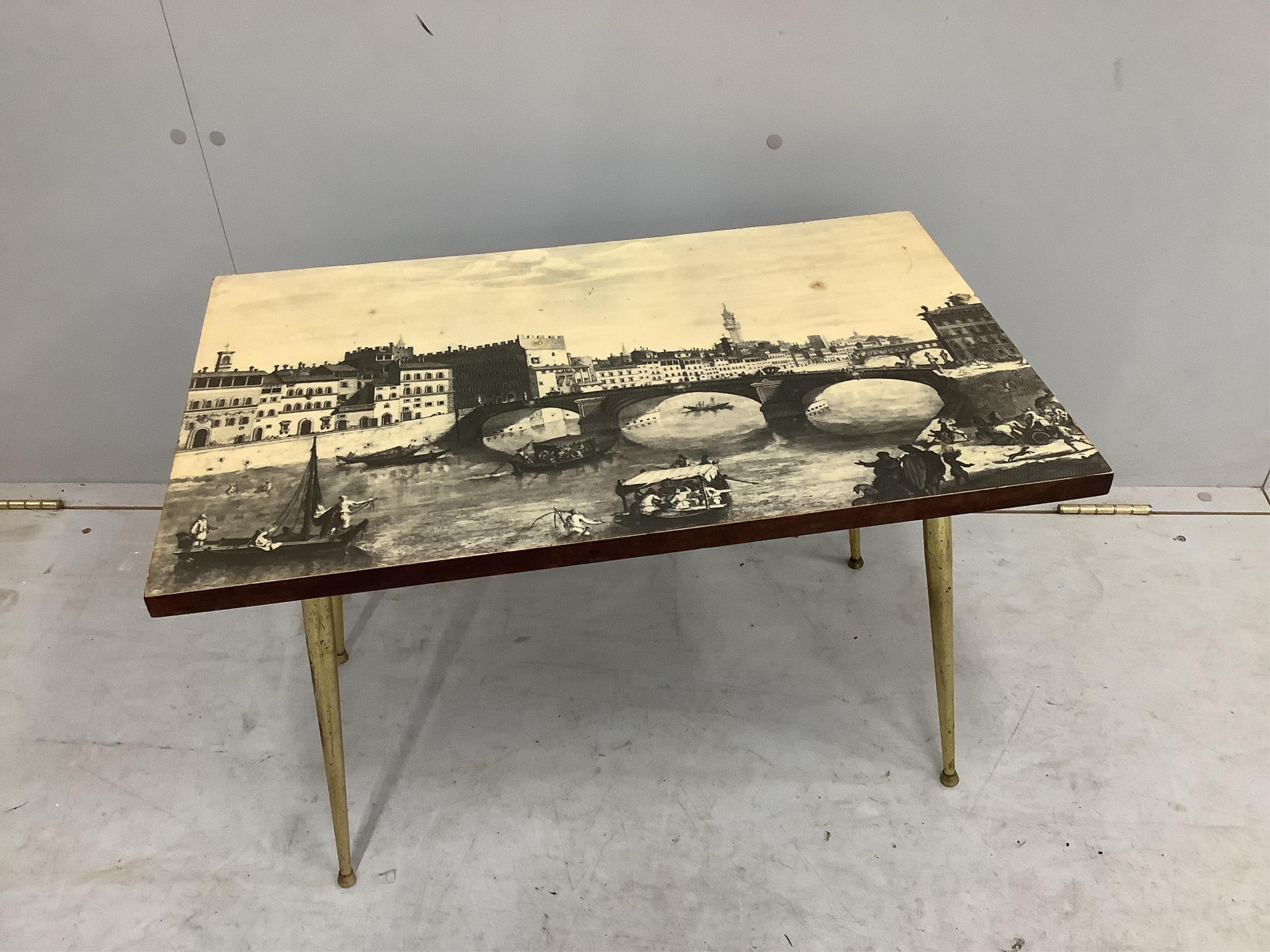 An Italian Fornasetti style rectangular coffee table, printed with a Florence canal scene, width 65cm, depth 40cm, height 43cm. Condition - fair